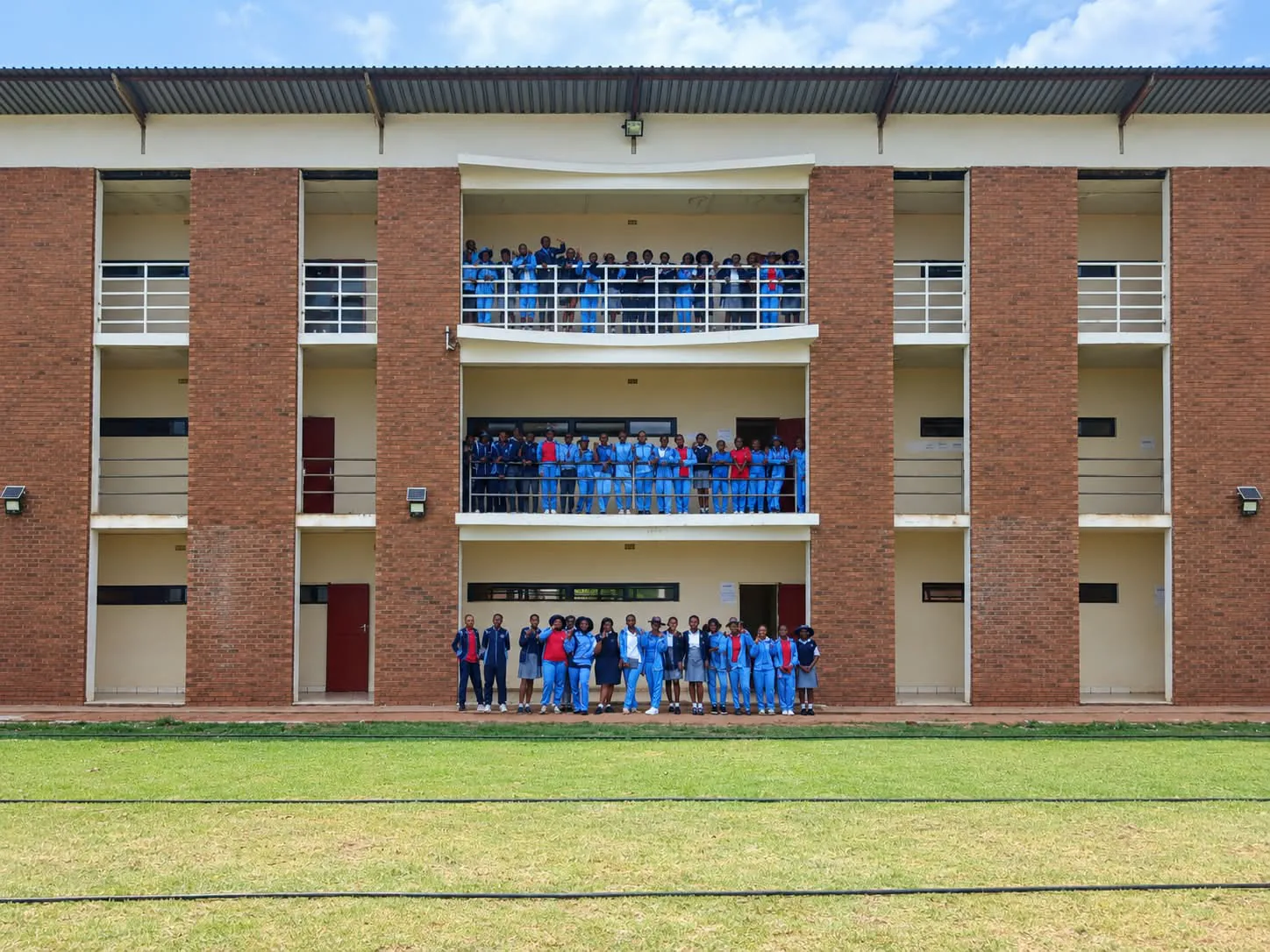Learners on all three floors of the classroom block